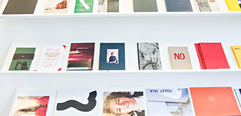 graphic-design-publications-on-shelves-cropped-990×475