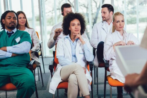 Group of doctors on seminar in lecture hall at hospital. Hospital, profession, people and medicine concept